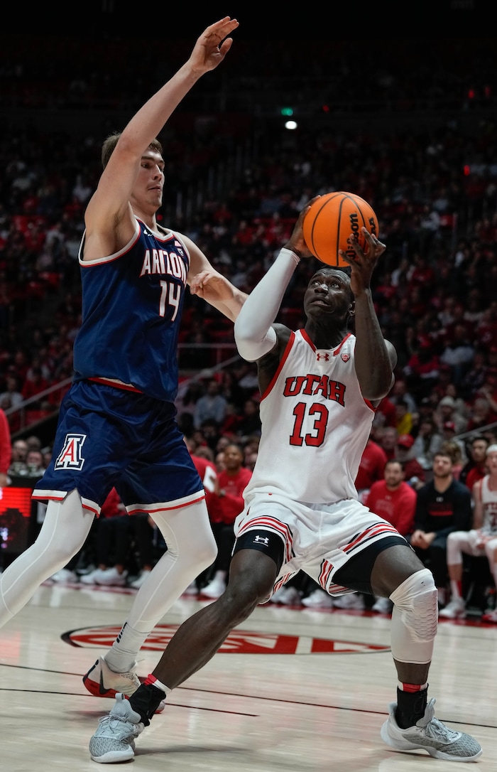 (Francisco Kjolseth  |  The Salt Lake Tribune) Arizona Wildcats center Motiejus Krivas (14) tries to block Utah Utes center Keba Keita (13) in PAC-12 basketball action between the Utah Utes and the Arizona Wildcats at the Jon M. Huntsman Center, on Thursday, Feb. 8, 2024.