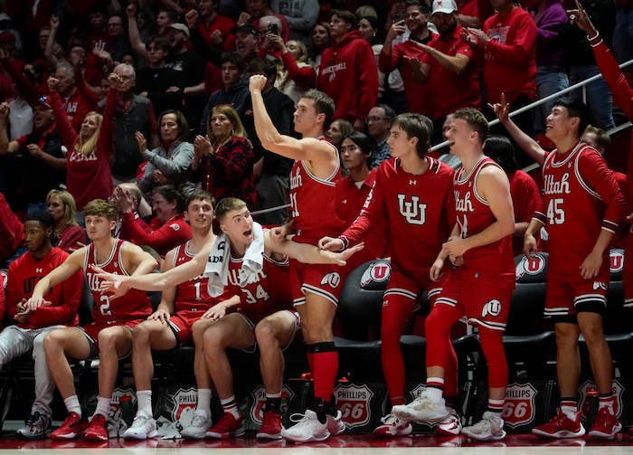 (Bethany Baker  |  The Salt Lake Tribune) The Utah Utes react from the bench during the game against the Brigham Young Cougars at the Jon M. Huntsman Center in Salt Lake City on Saturday, Dec. 9, 2023.