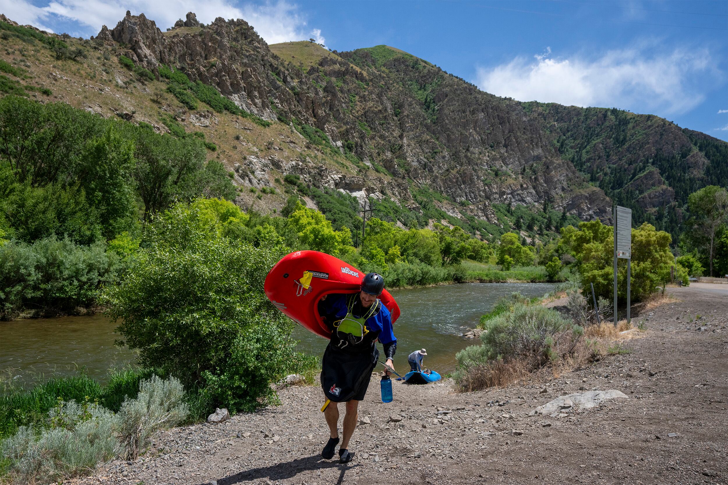 (Rick Egan | The Salt Lake Tribune) A rafter walks to his car at the Taggart takeout point on the Weber River, on Friday, June 21, 2024.
