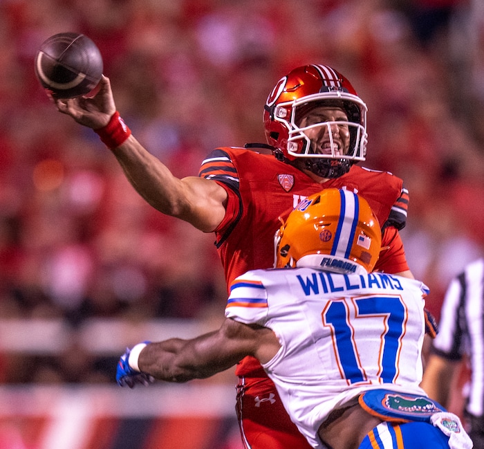 (Rick Egan | The Salt Lake Tribune) 
Quarterback Bryson Barnes (16) is hit by Florida Gators linebacker Scooby Williams (17) as he releases the ball, in football action between the Utah Utes and the Florida Gators. At Rice-Eccles Stadium, on Thursday, Aug. 31, 2023.
