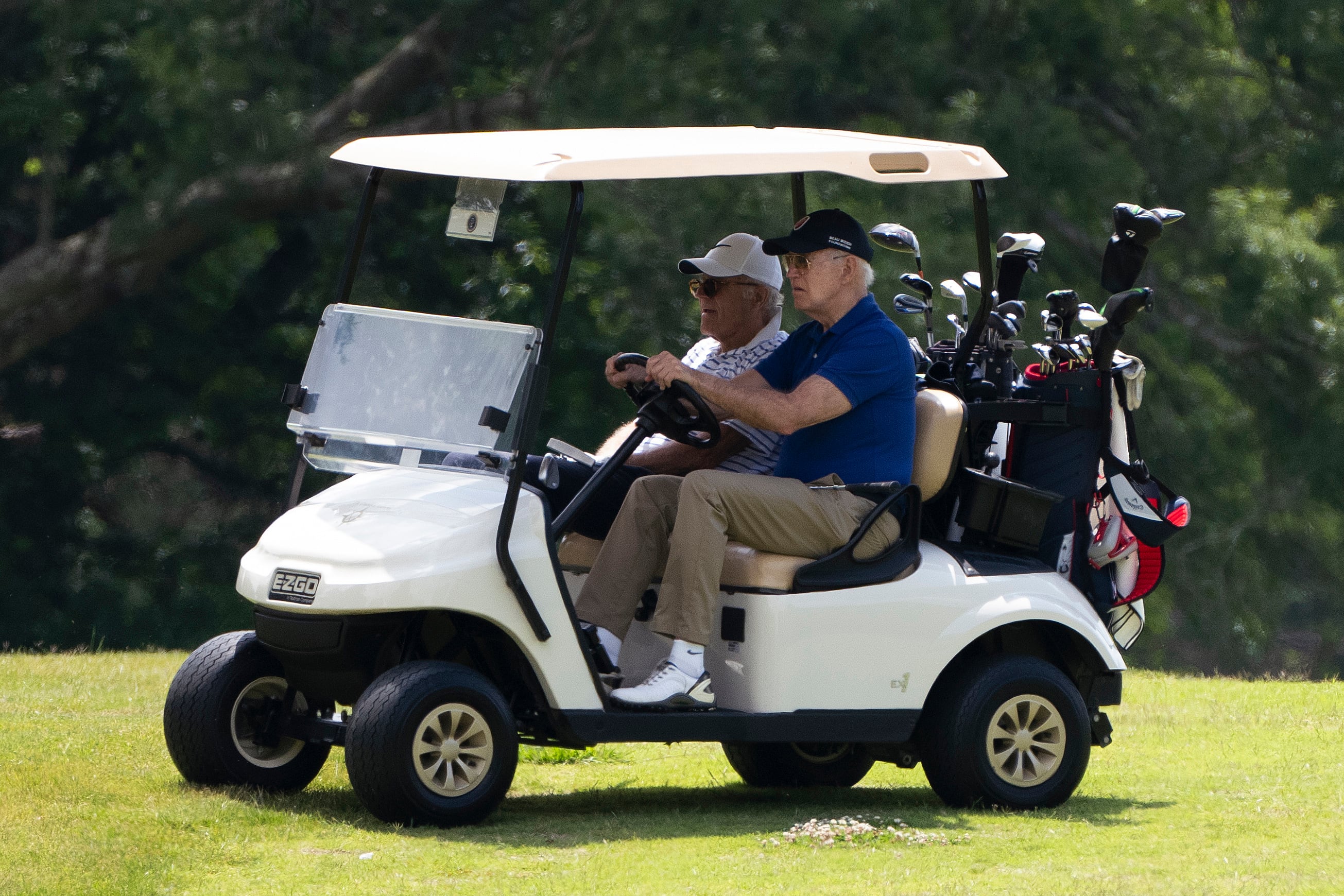 President Joe Biden drives a golf cart with his brother Jimmy Biden at Andrews Air Force Base, Md., Sunday, June 4,2023. (AP Photo/Manuel Balce Ceneta)