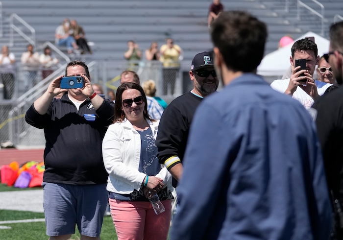 (Bethany Baker  |  The Salt Lake Tribune) People take photos of Kevin Bacon during a charity event to commemorate the 40th anniversary of the movie "Footloose" on the football field of Payson High School in Payson on Saturday, April 20, 2024.