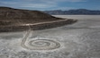 (Leah Hogsten | The Salt Lake Tribune)  People explore the Spiral Jetty, just south of the Rozel Point peninsula on the northeastern shore, March 25, 2022. The Land Art work by Robert Smithson has been added to the National Register of Historic Places.