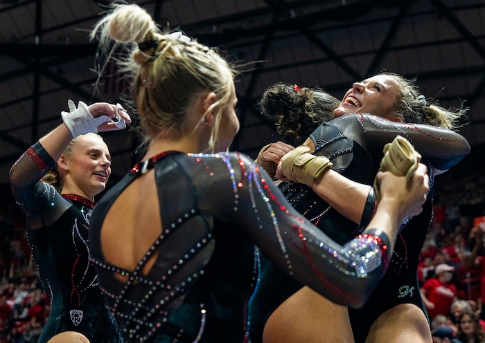 (Rick Egan | The Salt Lake Tribune)  Jaylene Gilstrap gets hugs after her vault, in gymnastics action between Utah  Red Rocks and Oregon State, at the Jon M. Huntsman Center, on Friday, Feb. 2, 2024.
