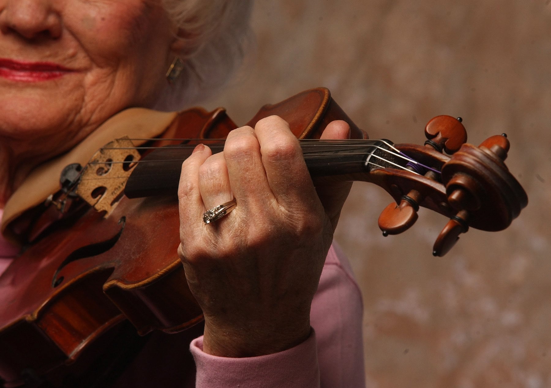 (Leah Hogsten | The Salt Lake Tribune) Frances Darger holds her violin in 2005.