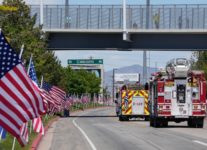 (Francisco Kjolseth  |  The Salt Lake Tribune) The funeral procession follows the hearse containing the body of Santaquin police Sgt. Bill Hooser following ceremonies at the UCCU Center at Utah Valley University in Orem on Monday, May 13, 2024.