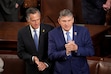 (Doug Mills | The New York Times) Sens. Mitt Romney, R-Utah, and Joe Manchin, D-W.Va., before President Joe Biden delivers the State of the Union address in March.