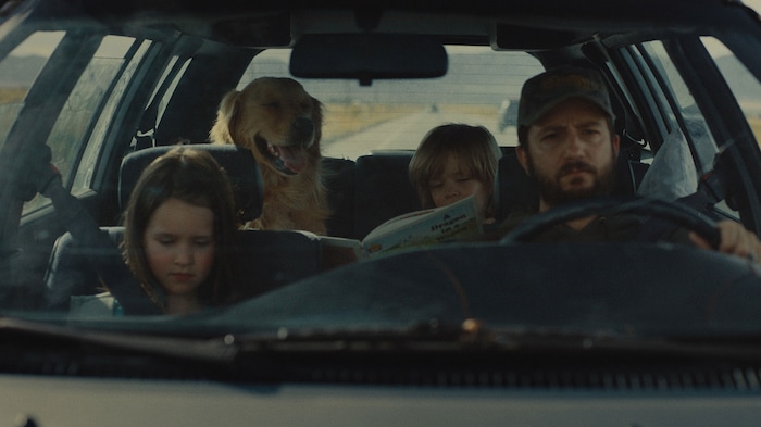 (Sundance Institute) Wyatt Solis, rear, and Molly Belle Wright, left, play children on a cross-country trip with their dad (John Magaro, right), in director Cole Webley's "Omaha," an official selection of the 2025 Sundance Film Festival, in the U.S. Dramatic competition.