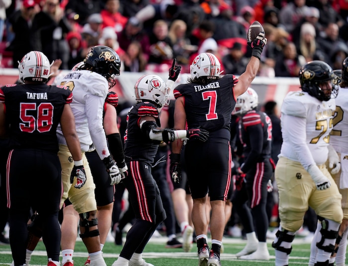 (Bethany Baker  |  The Salt Lake Tribune) Utah Utes defensive end Van Fillinger (7) raises the ball after a turnover against the Colorado Buffaloes at Rice-Eccles Stadium in Salt Lake City on Saturday, Nov. 25, 2023.