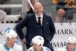 (Gene J. Puskar | AP) Utah Hockey Club head coach Andre Tourigny stands behind his bench during the third period of an NHL hockey game against the Pittsburgh Penguins, Saturday, Nov. 23, 2024, in Pittsburgh. 