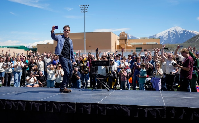 (Bethany Baker  |  The Salt Lake Tribune) Kevin Bacon records a video with the crowd, playing into the "six degrees from Kevin Bacon" game, following a charity event to commemorate the 40th anniversary of the movie "Footloose" on the football field of Payson High School in Payson on Saturday, April 20, 2024.