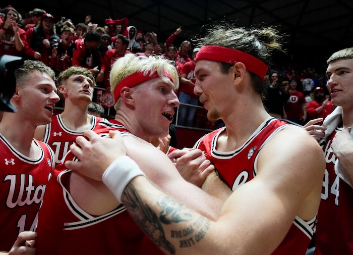 (Bethany Baker  |  The Salt Lake Tribune) Utah Utes guard Hunter Erickson, left, and Utah Utes center Branden Carlson, right, react after defeating the Brigham Young Cougars at the Jon M. Huntsman Center in Salt Lake City on Saturday, Dec. 9, 2023.