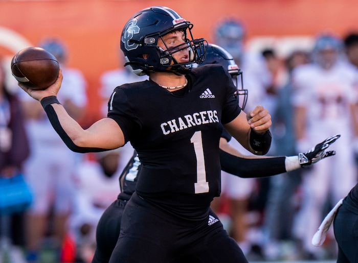 (Rick Egan | The Salt Lake Tribune) Corner Canyon QB Isaac Wilson (1) throws downfield, in 6A State playoff action between the Corner Canyon Chargers and the Skyridge Falcons, at Rice-Eccles Stadium, on Friday, Nov. 17, 2023.