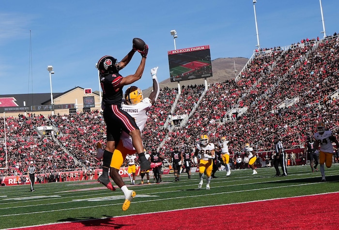 (Francisco Kjolseth  |  The Salt Lake Tribune) Utah Utes wide receiver Munir McClain (4) catches a touchdown pass over Arizona State Sun Devils defensive back Ro Torrence (9) in NCAA football in Salt Lake City on Saturday, Nov. 4, 2023.