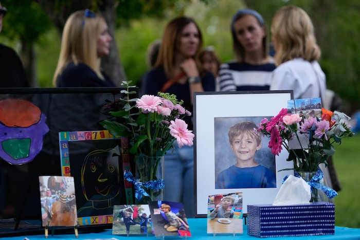 (Francisco Kjolseth  |  The Salt Lake Tribune) Photos of 6-year-old Uintah Elementary first grader Adlai Owen, are displayed at Laird Park in Salt Lake City during a memorial on Wednesday, May 22, 2024. Police say Adlai’s father, Sam Owen, fatally shot Adlai before killing himself in an apparent murder-suicide on Saturday, May 18, 2024.