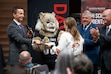 (Benjamin Zack | Weber State University) The presidents of Weber State University, Davis Technical College and Ogden-Weber Technical College present Ogden High School senior Grace Malan with an acceptance letter during the announcement of a new initiative to automatically admit over 10,000 high school seniors in Davis, Morgan, and Weber Counties on Thursday, Oct. 10, 2024.