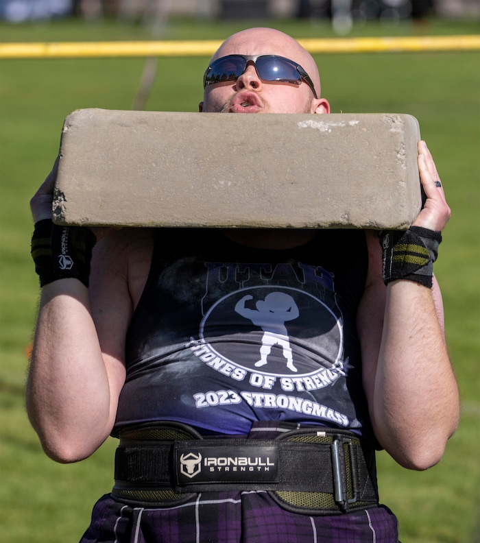 (Rick Egan | The Salt Lake Tribune)  Daniel Moote competes in the Stone Press event in the Utah Stones of Strength Strongman competition at the Utah Scottish Festival, at the Utah State Fairpark, on Friday, June 16, 2023.
