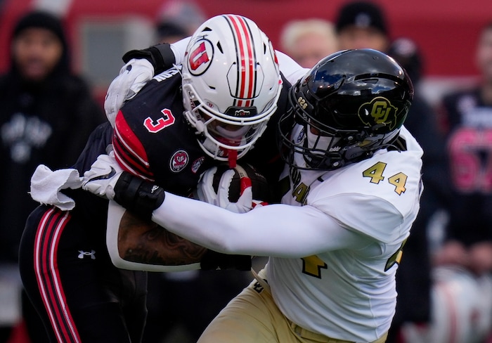 (Bethany Baker  |  The Salt Lake Tribune) Utah Utes running back Ja'Quinden Jackson (3) runs the ball as he is tackled by Colorado Buffaloes linebacker Jordan Domineck (44) at Rice-Eccles Stadium in Salt Lake City on Saturday, Nov. 25, 2023.