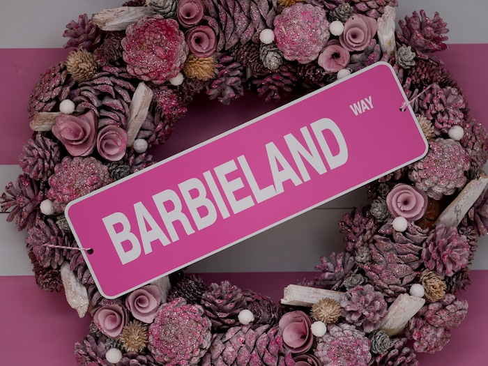 (Bethany Baker  |  The Salt Lake Tribune) A pink wreath hangs outside a home in a section of Daybreak that has collectively created a Barbieland-themed community for Halloween on Wednesday, Oct. 11, 2023.