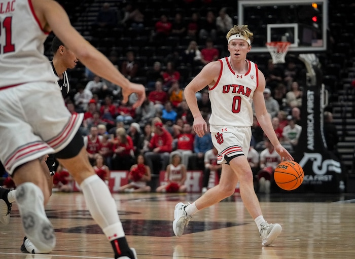 (Bethany Baker  |  The Salt Lake Tribune) Utah Utes guard Hunter Erickson (0) moves the ball against the Hawaii Warriors at the Delta Center in Salt Lake City on Thursday, Nov. 30, 2023.