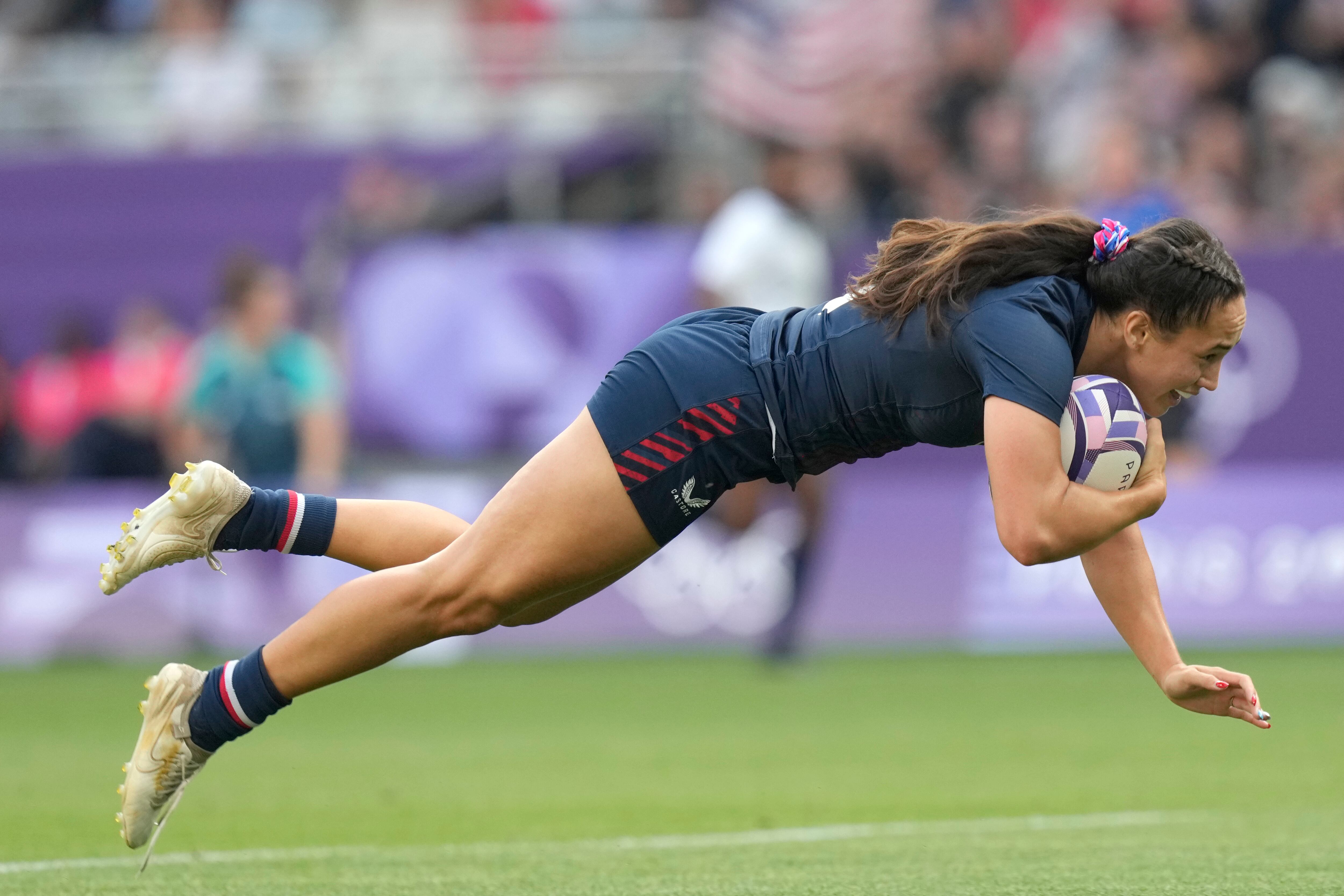 (Vadim Ghirda | AP) United States' Alex Sedrick scores the winning try during the women's bronze medal Rugby Sevens match between the United States and Australia at the 2024 Summer Olympics, in the Stade de France, in Saint-Denis, France, Tuesday, July 30, 2024. The US won the match 14-12.