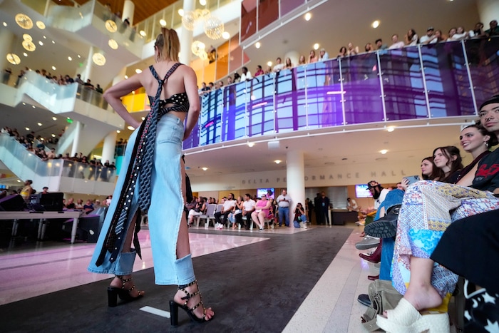 (Francisco Kjolseth | The Salt Lake Tribune) Models showcase the works of seven local designers while paired with hip-hop artists, all based in Utah, filling the Eccles Theater with music spilling out onto the street on Friday, July 21, 2023, as part of Main Street : A Fashion and Music Experience. 