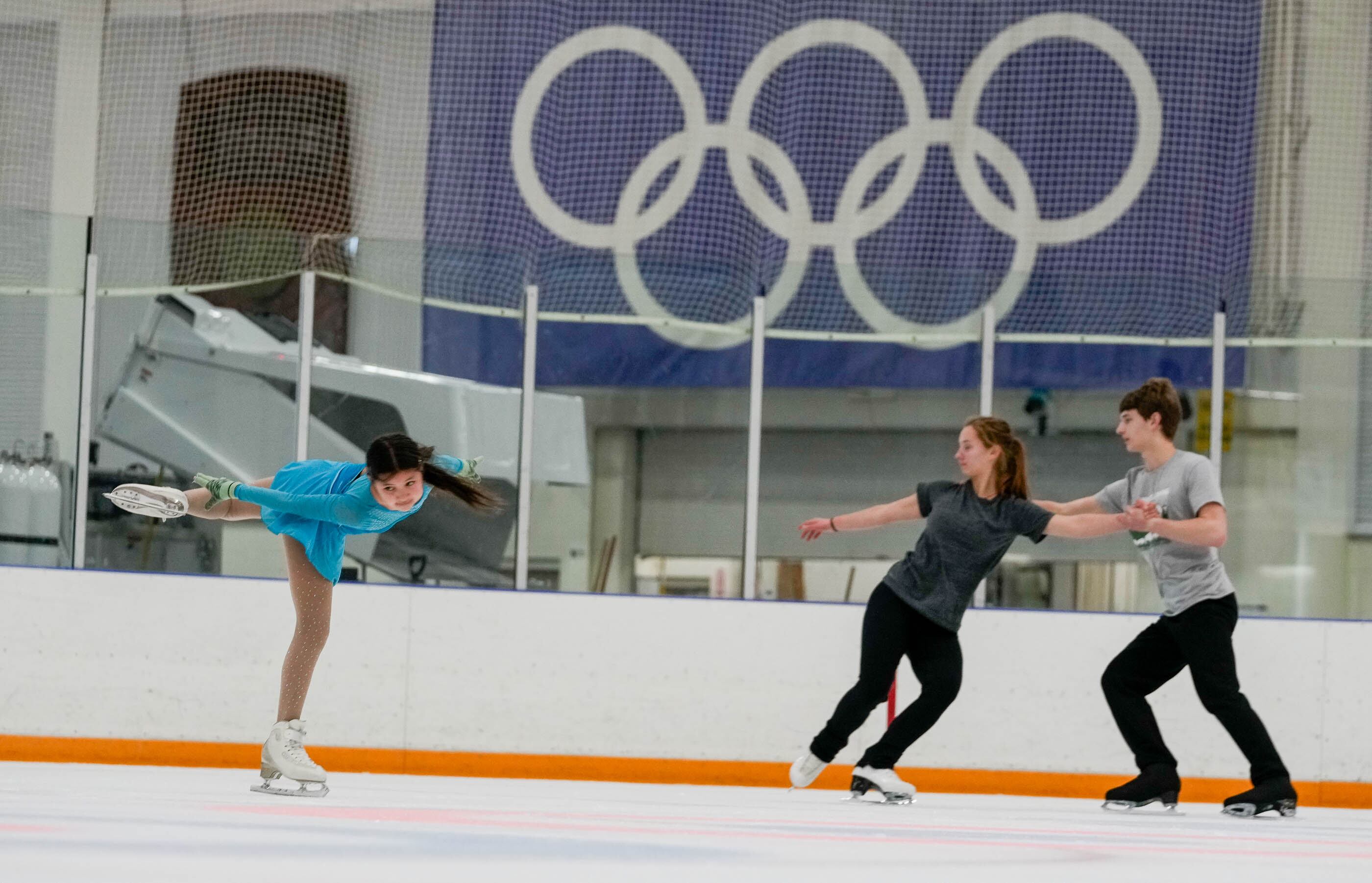 (Francisco Kjolseth | The Salt Lake Tribune) Victoria Upwall, 11, and Aubryn Sago and Colson Sago skate at the Utah Olympic Oval in Kearns on Friday, April 12, 2024.