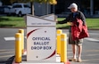 (Rick Egan | The Salt Lake Tribune)  Travis Drown deposits his ballot in the drop box at Salt Lake County Government Center, on Wednesday, Oct. 30, 2024.
