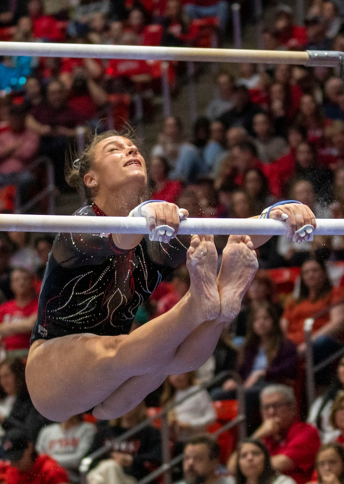 (Rick Egan | The Salt Lake Tribune)  Grace McCallum performs on the bars, in gymnastics action between Utah Red Rocks and Oregon State, at the Jon M. Huntsman Center, on Friday, Feb. 2, 2024.
