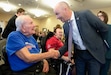 (Francisco Kjolseth  | The Salt Lake Tribune) Gov. Spencer Cox meets veterans Gordon Steck, left, and Daniel Butz, both residents of the William E. Christoffersen Salt Lake Veterans Home, as the governor gets ready to present budget recommendations and priorities for 2026 on Thursday, Dec. 5, 2024.