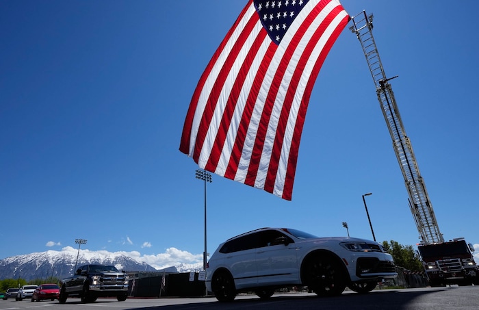 (Francisco Kjolseth  |  The Salt Lake Tribune) The procession begins following funeral services for Santaquin police Sgt. Bill Hooser at the UCCU Center at Utah Valley University on Monday, May 13, 2024.