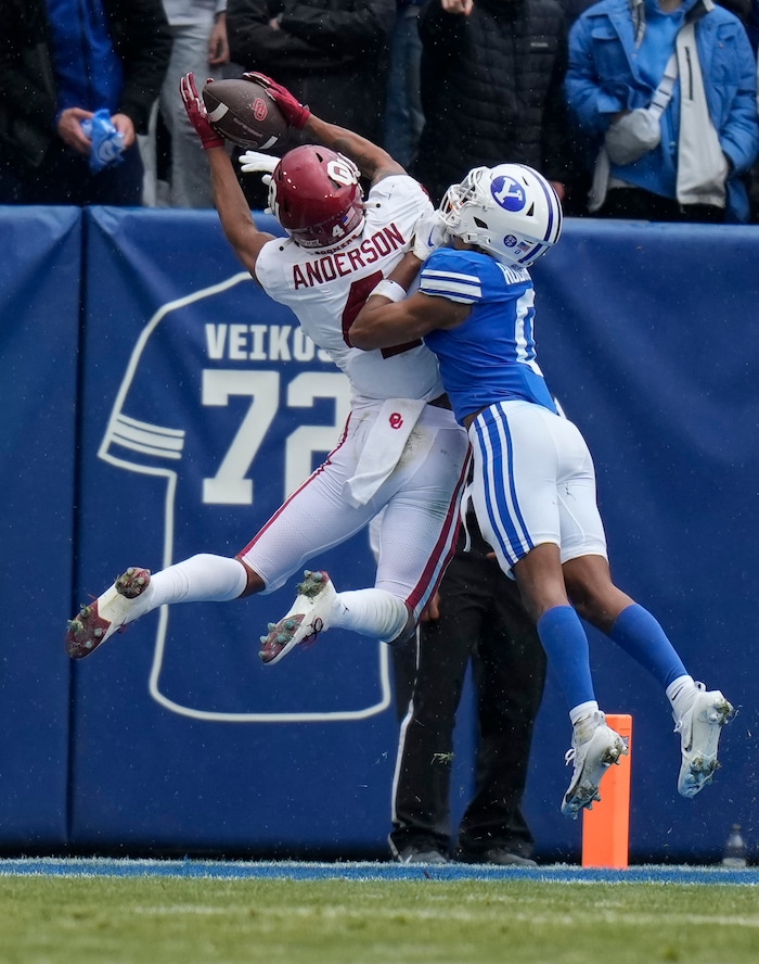 (Bethany Baker  |  The Salt Lake Tribune) Oklahoma Sooners wide receiver Nic Anderson (4) makes a catch out of bounds as Brigham Young Cougars cornerback Jakob Robinson (0) defends at LaVell Edwards Stadium in Provo on Saturday, Nov. 18, 2023.