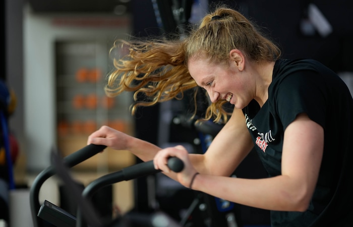 (Francisco Kjolseth  |  The Salt Lake Tribune) Gianna Kneepkens suns through a series of training drills, including multiple rounds on the assault bike, on Wednesday, Jan. 24, 2024. Kneepkens is making her way back to the court following a season-ending injury that left her with multiple broken bones in her foot. 