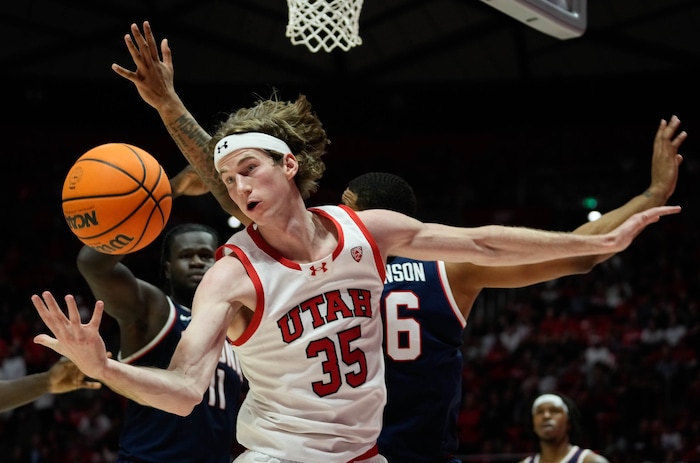 (Francisco Kjolseth  |  The Salt Lake Tribune) Utah Utes center Branden Carlson (35) tries to regain control of the ball in PAC-12 basketball action between the Utah Utes and the Arizona Wildcats at the Jon M. Huntsman Center, on Thursday, Feb. 8, 2024.