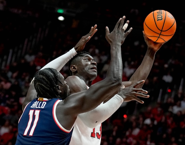 (Francisco Kjolseth  |  The Salt Lake Tribune) Arizona Wildcats center Oumar Ballo (11) bears down on Utah Utes center Keba Keita (13) in PAC-12 basketball action between the Utah Utes and the Arizona Wildcats at the Jon M. Huntsman Center, on Thursday, Feb. 8, 2024.