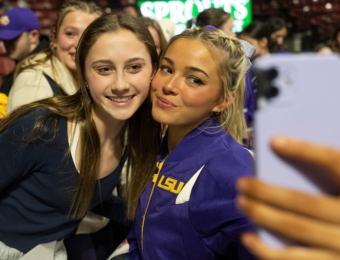 (Rick Egan | The Salt Lake Tribune)  LSU gymnast Livvy Dunne takes a selfie with Cani Lee from Marin, Ca, after a gymnastics meet between Utah, LSU, Oklahoma and UCLA at the Maverik Center, on Saturday, Jan. 13, 2024.
