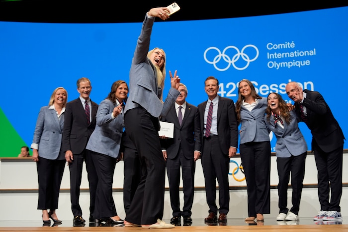 (David Goldman | AP) Former US skier Lindsey Vonn makes a selfie with the Salt Lake City delegation after Salt Lake City was named Olympics host again as the IOC formally awarded the 2034 Winter Games to the United States bid, Wednesday, July 24, 2024, in Paris.