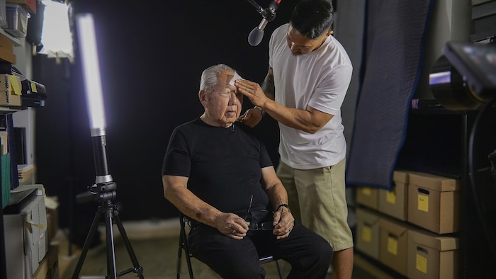 (Sundance Institute) Director Tadashi Nakamura tends to his father, media artist Robert A. Nakamura, while filming "Third Act," an official selection of the 2025 Sundance Film Festival, in the U.S. Documentary competition.