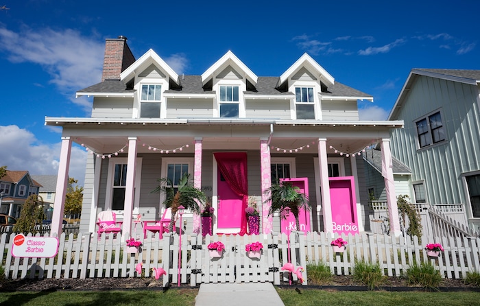 (Bethany Baker  |  The Salt Lake Tribune) A home is decorated in a “Classic Barbie” theme from the movie “Barbie” in a section of Daybreak that has collectively created a Barbieland-themed community for Halloween on Wednesday, Oct. 11, 2023.