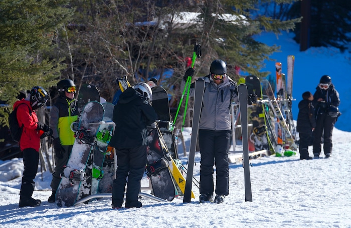 (Bethany Baker  |  The Salt Lake Tribune) Skiers and snowboarders adjust their gear at Sundance Resort near Provo on Thursday, Dec. 14, 2023.