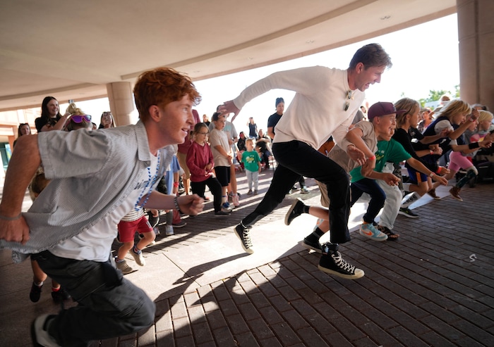 (Francisco Kjolseth  | The Salt Lake Tribune) Hunter Woodhall races family members of patients at Shriners Children’s Hospital in Salt Lake City on Wednesday, Sept. 18, 2024. Woodhall had his legs amputated when he was 11 months old and spent much of his youth at the hospital.