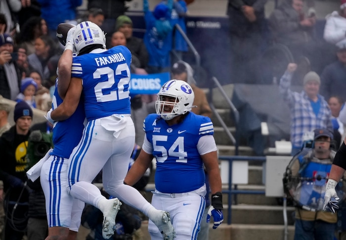 (Bethany Baker  |  The Salt Lake Tribune) Brigham Young Cougars celebrate after a touchdown against the Oklahoma Sooners at LaVell Edwards Stadium in Provo on Saturday, Nov. 18, 2023.