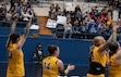 (Amy Osborne | The New York Times) People hold signs in the audience as San Jose State University women's volleyball team takes on Fresno State in San Jose, Calif., Nov. 18, 2024. One sign says, "Block out the haters."