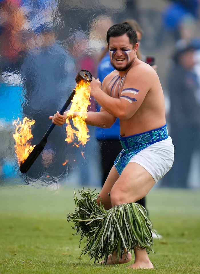 Performers dance during the game at LaVell Edwards Stadium in Provo on Saturday, Nov. 18, 2023.