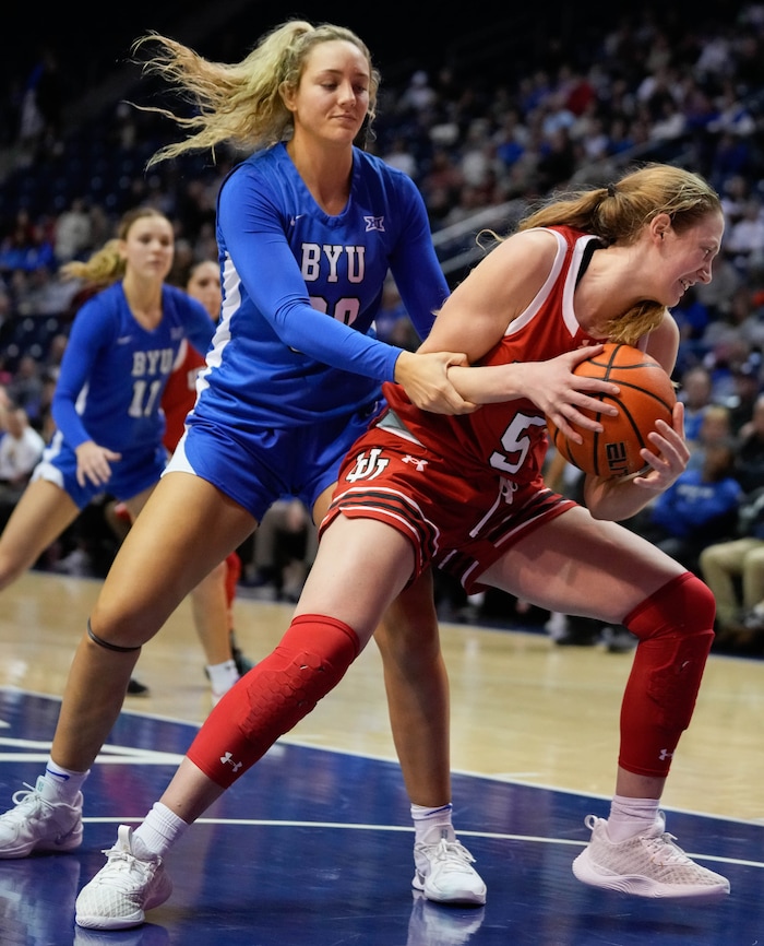 (Francisco Kjolseth  | The Salt Lake Tribune) BYU Cougars guard Lauren Davenport (30) fouls Utah Utes guard Gianna Kneepkens (5) as BYU hosts Utah, NCAA basketball in Provo on Saturday, Jan. 25, 2025.