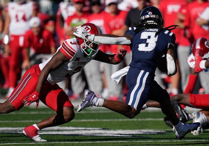 (Francisco Kjolseth  | The Salt Lake Tribune) Utah State Aggies running back Rahsul Faison (3) is chased down by Utah Utes linebacker Johnathan Hall (3) as Utah State hosts the University of Utah during the second half of an NCAA college football game Saturday, Sept. 14, 2024, in Logan, Utah.