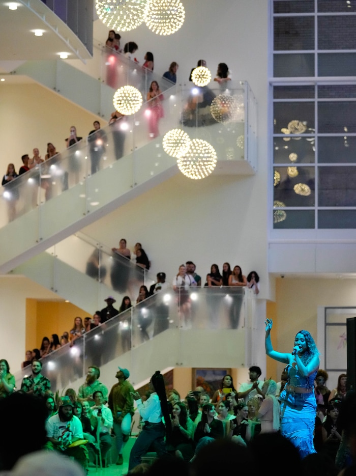 (Francisco Kjolseth | The Salt Lake Tribune) Vocalist Detzany fills the lobby of the Eccles Theater with sound on Friday, July 21, 2023, as models walk the runway showcasing the work of local artists for an event called Main Street: A Fashion and Music Experience. The free show that jam-packed the lobby and upper-level balconies drew an outside crowd as models briefly walked outside, carried by the vocals. 