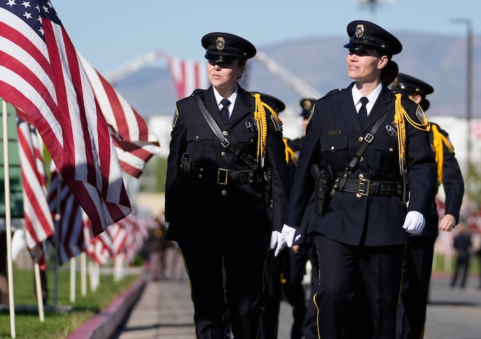 (Francisco Kjolseth  |  The Salt Lake Tribune) Law enforcement arrives for funeral services for Santaquin police Sgt. Bill Hooser at the UCCU Center at Utah Valley University on Monday, May 13, 2024.