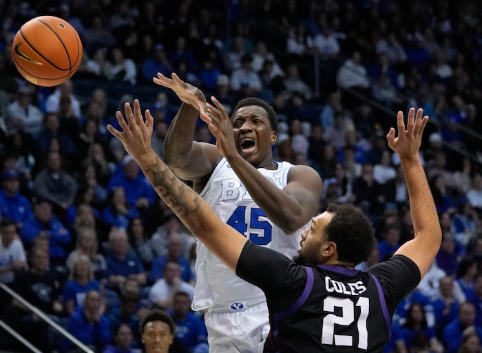 (Francisco Kjolseth  |  The Salt Lake Tribune) Brigham Young Cougars forward Fousseyni Traore (45) loses control of a ball against TCU Horned Frogs forward JaKobe Coles (21) during an NCAA college basketball game against TCU Saturday, March 2, 2024, in Provo, Utah.