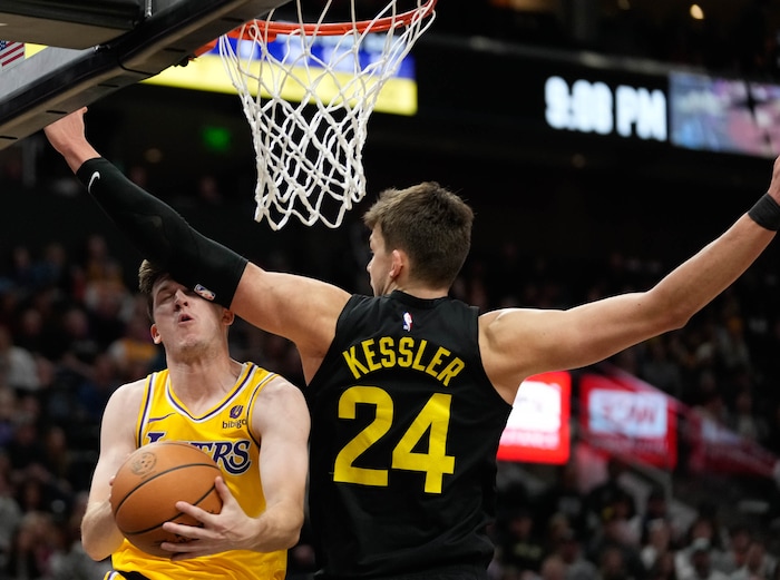 (Francisco Kjolseth  |  The Salt Lake Tribune) Los Angeles Lakers guard Austin Reaves (15) is defended by Utah Jazz center Walker Kessler (24) during an NBA basketball game Wednesday, Feb. 14, 2024, in Salt Lake City.